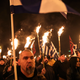 Supporters of Greece’s extreme right Golden Dawn party raise torches during a rally on Jan. 28, 2017.